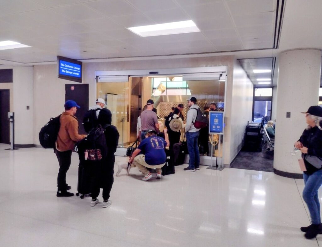 Passengers Queue-Up for Elite Lounge: In an empty terminal,
