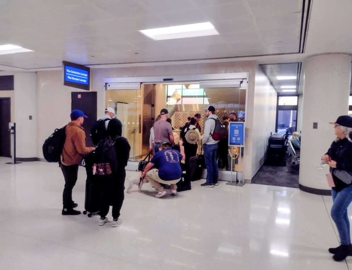 Passengers Queue-Up for Elite Lounge: In an empty terminal,